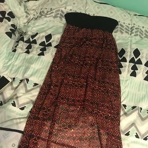 Sleeveless black, red and orange design dress